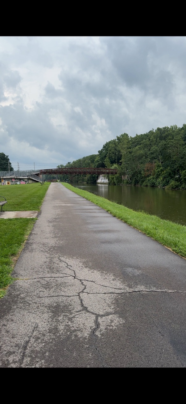 The Erie Canal, trail and pedestrian bridge at the edge of the campus today