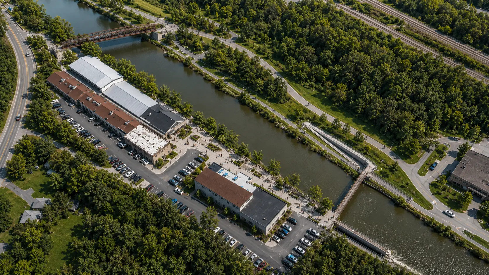 Aerial conceptual rendering showing the campus in its canal context